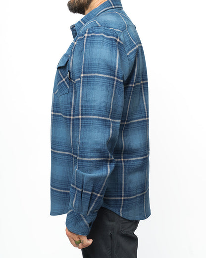 Pale blue Destroyer Flannel shirt by Off The Grid Surplus with a soft, cozy fabric and classic plaid pattern.