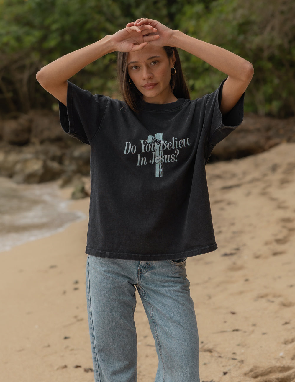 Black heavyweight Jesus t-shirt by Elevated Faith featuring the "Do You Believe in Jesus" slogan and religious graphic.