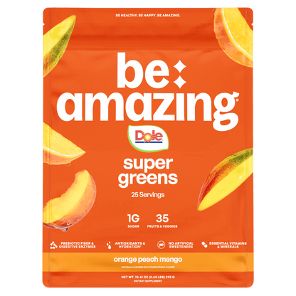 Be Amazing Super Greens powder with orange, peach, and mango flavors, featuring vibrant greens and fruit slices in the image.