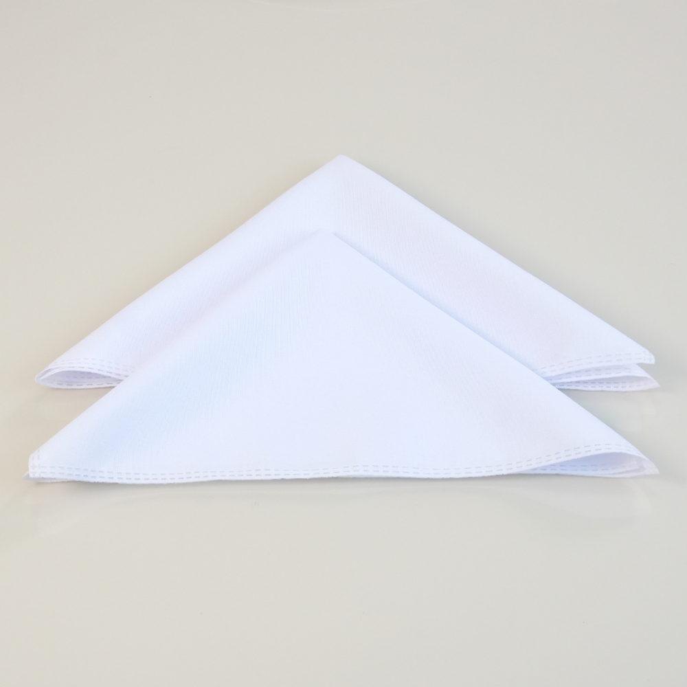 Set of white placemats with gold accents from Maison Charlo, includes table runner, napkins, and napkin rings for elegant table setting.