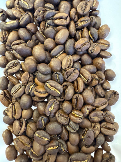 Rosted Velvet Amber Espresso Blend coffee beans from Good Brothers Coffee LLC in a rustic burlap bag.