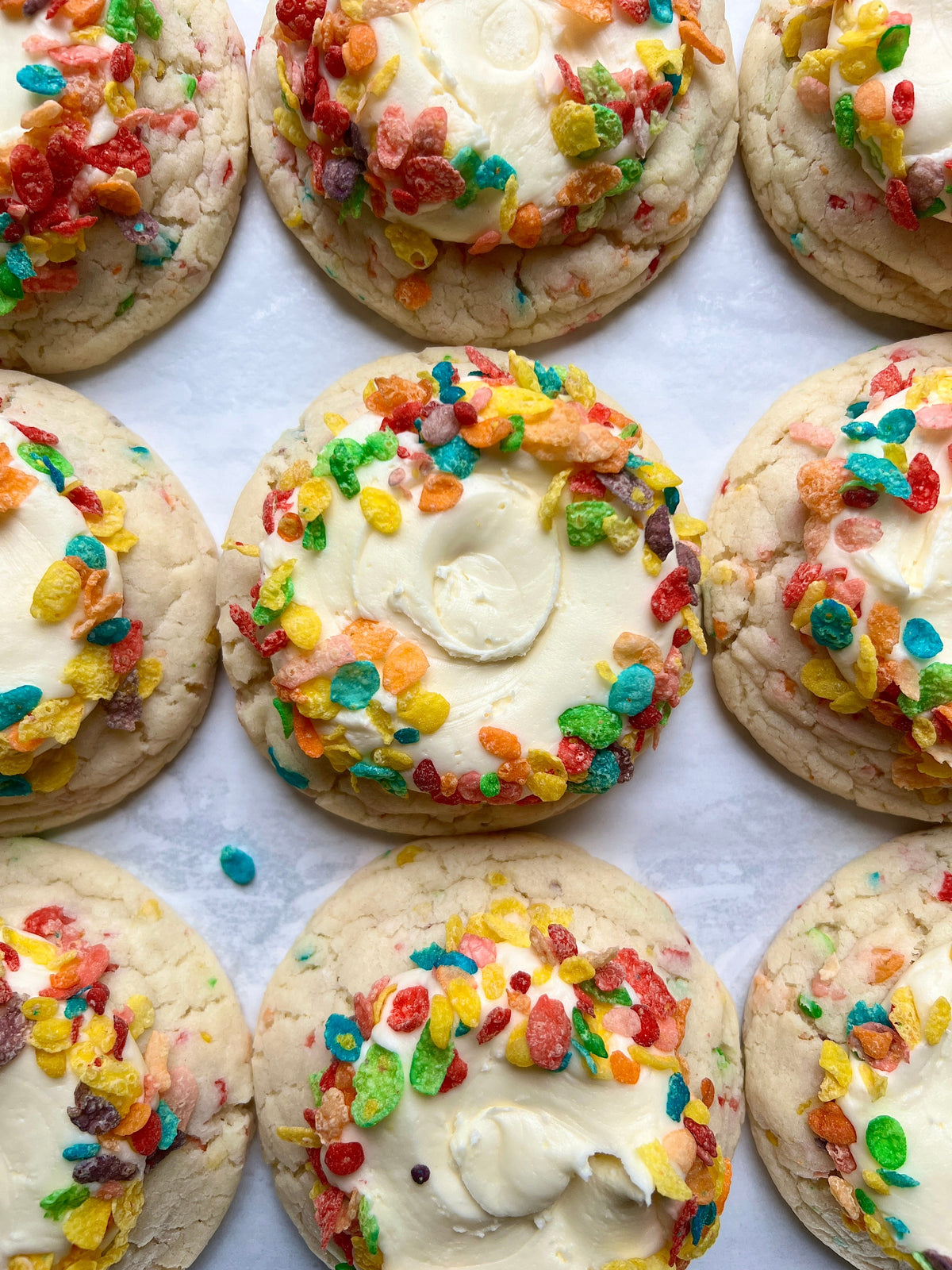 Let's Get Baked Artisan Desserts Fruity Pebbles cookies with colorful cereal pieces and sweet, crunchy texture on top.