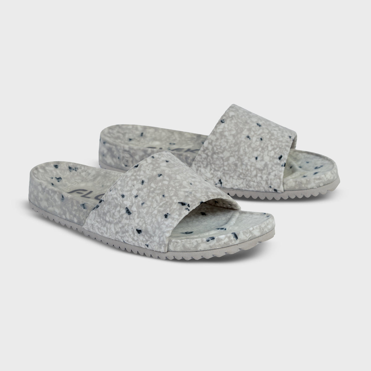 Fleks East Beach Slide in cloudy day colors, featuring a casual slip-on design and cloud-themed pattern.