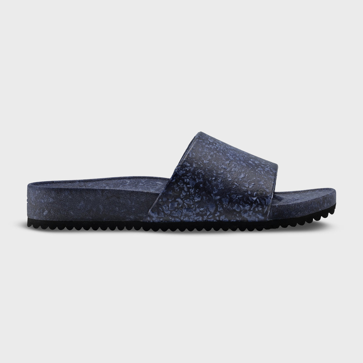 Fleks East Beach Slide in Deep Blue Sea color, featuring a comfortable slide sandal with textured sole and stylish design.