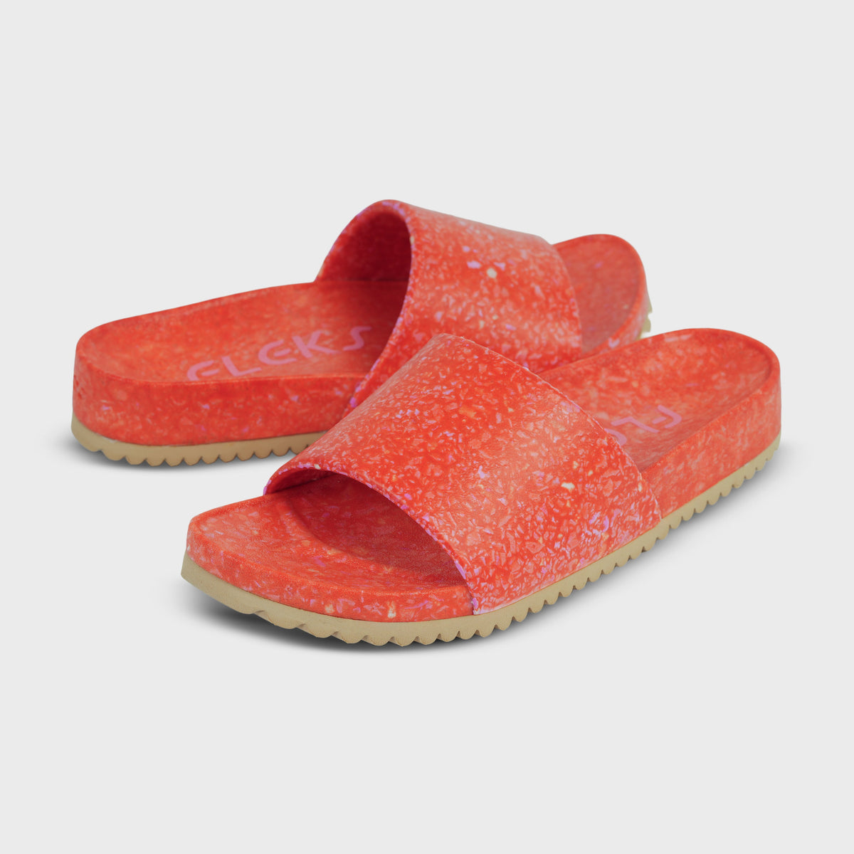 Fleks East Beach Slide featuring a starfish design, with a tan slide strap and starfish embellishment on the upper.