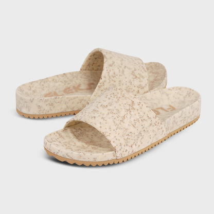 Fleks East Beach Slide in white sand, showcasing comfortable slide sandals designed for beachwear and casual summer style.