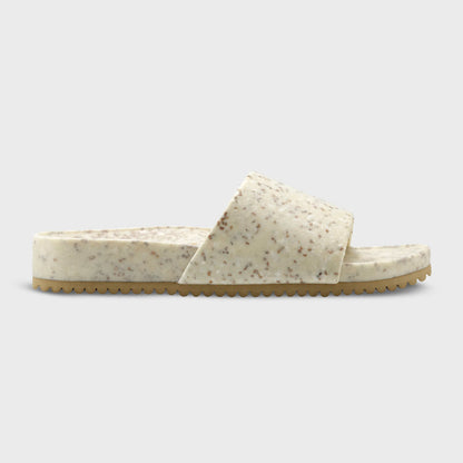 Fleks East Beach Slide in white sand beach style, featuring comfortable slip-on design and casual summer footwear.