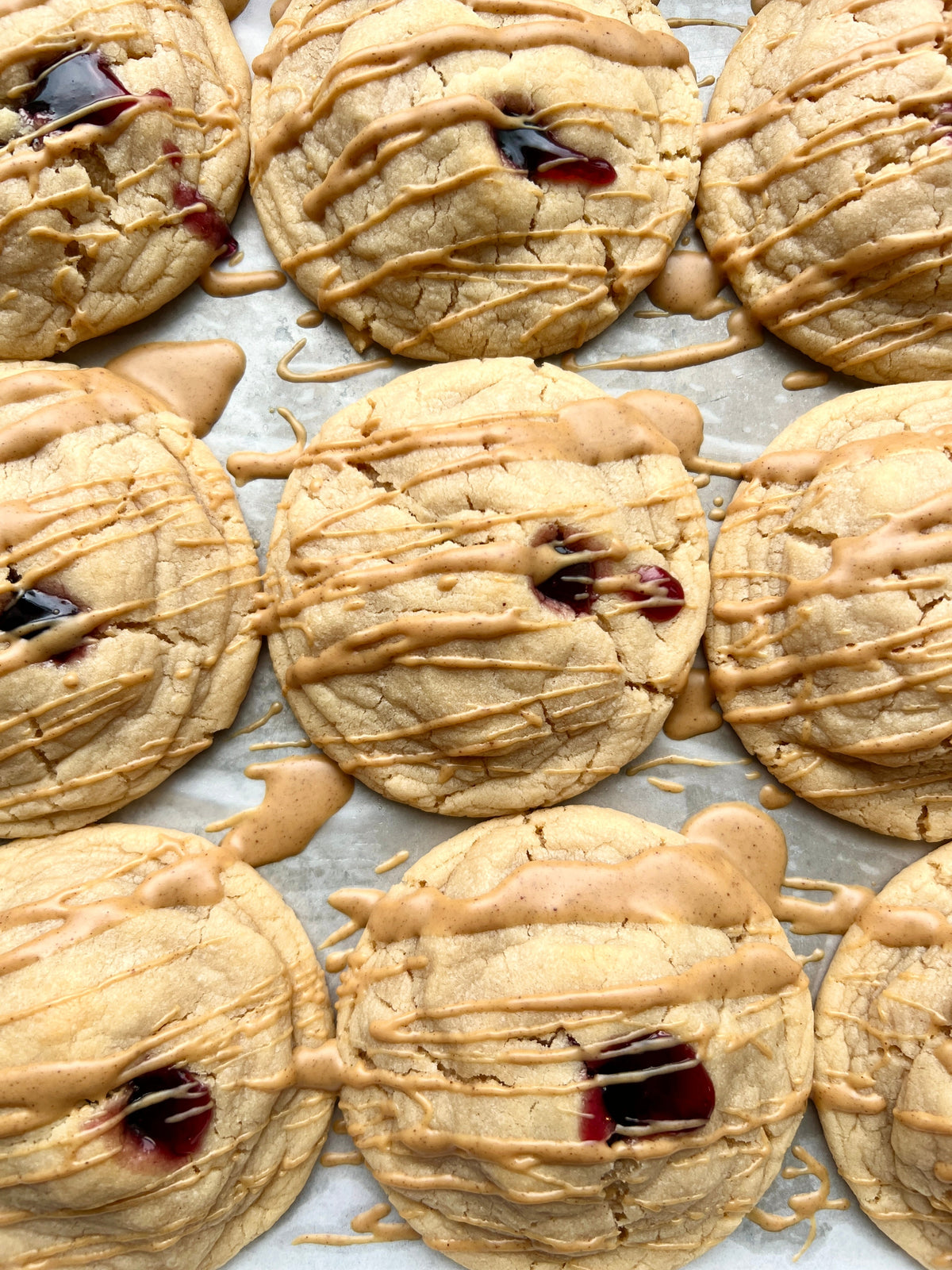 Slice of PB&J dessert from Let's Get Baked Artisan Desserts with peanut butter and jelly filling on a plate