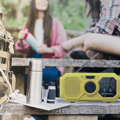 Emerson emergency AM/FM radio with weather band, flashlight, and power bank, shown with digital display and control buttons.