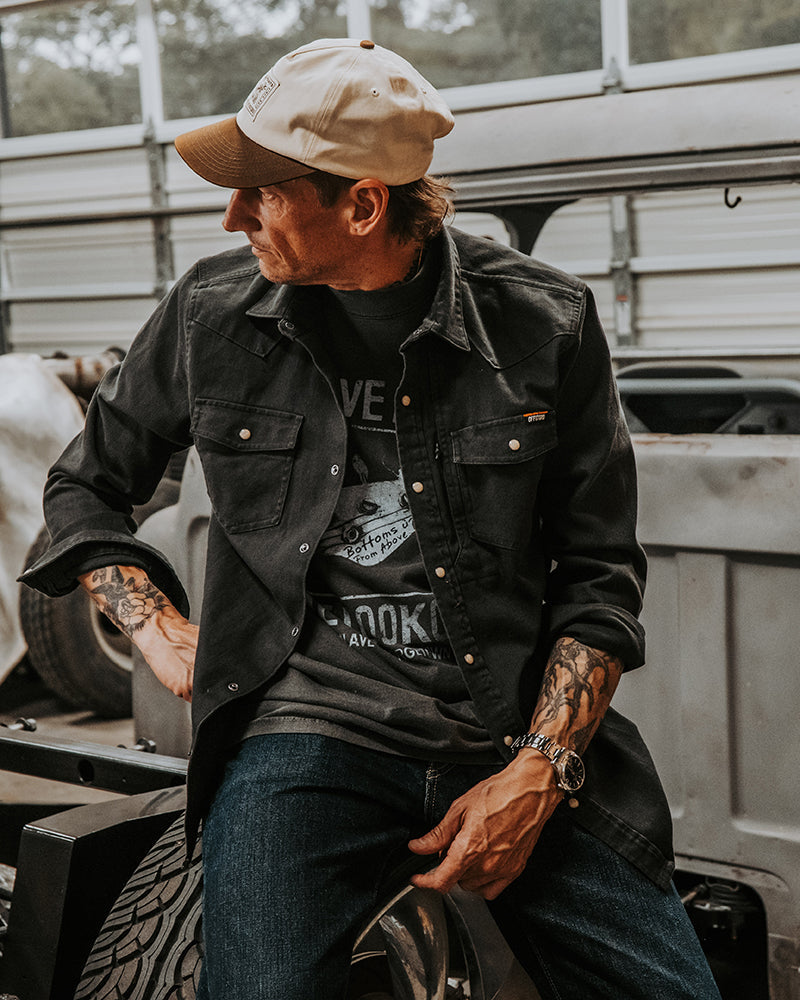 Off The Grid Surplus Earl Denim Shirt in vintage black, long sleeve denim top with classic stitching and button closure.
