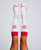 Equal Play women's over-the-calf soccer training socks by Goal Five in hot coral, designed for comfort and performance.