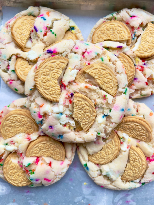 Decorative birthday cake cookies from Let's Get Baked Artisan Desserts, featuring colorful frosting and festive designs.