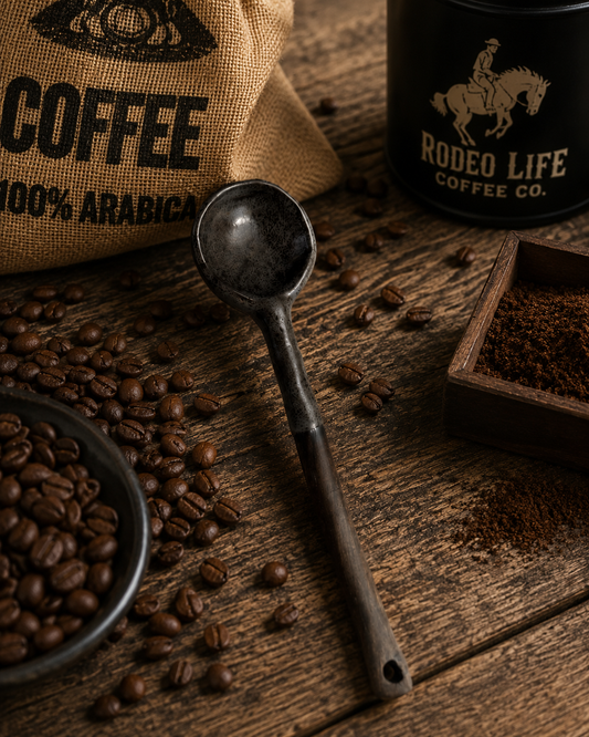 Handmade ceramic coffee scoop with a rustic finish, designed for measuring coffee grounds accurately.