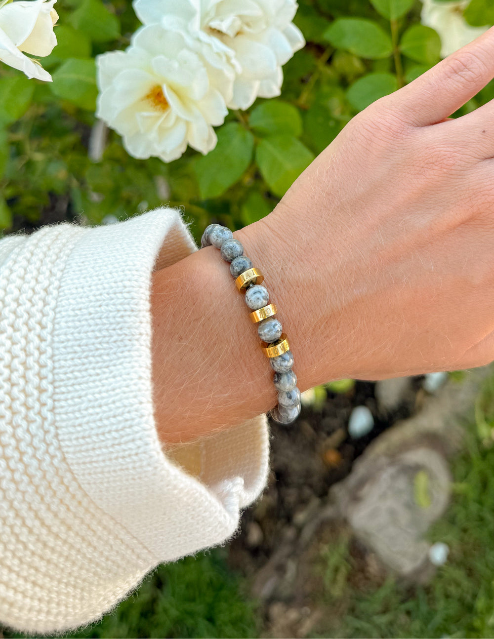 Elevated Faith stone bracelet featuring Faith, Hope, and Love charms on a beaded bracelet for meaningful jewelry.