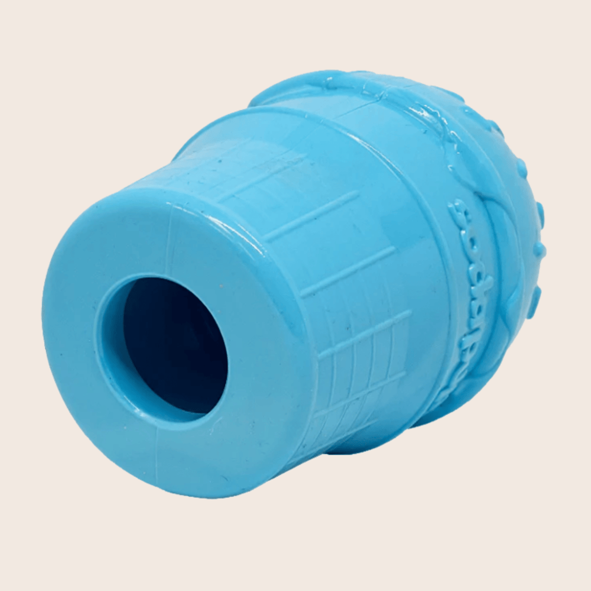 Blue Farm To Pet dog treat dispenser viewed from bottom, showcasing its treat storage and dispensing opening.