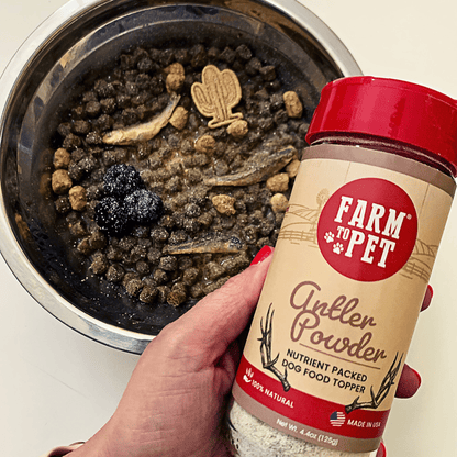 Farm to Pet elk antler powder dog food topper in a bowl, nutritious supplement for dogs and cats with natural antler ingredients.
