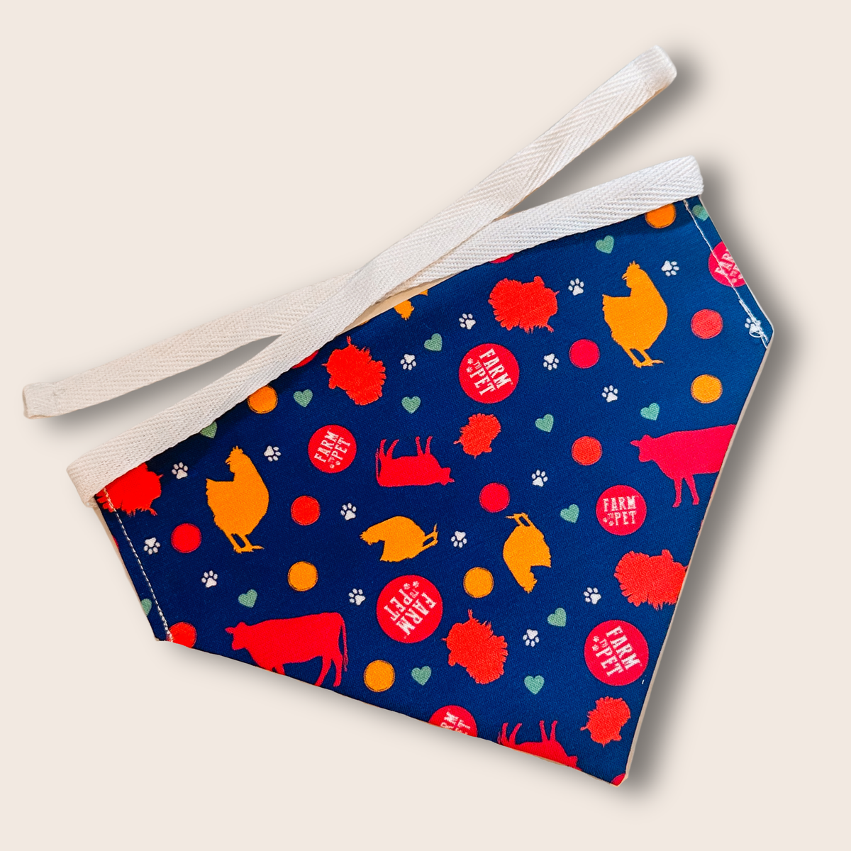 Farm To Pet tie-on dog bandana with adjustable string tie, featuring a stylish design for dogs and cats.
