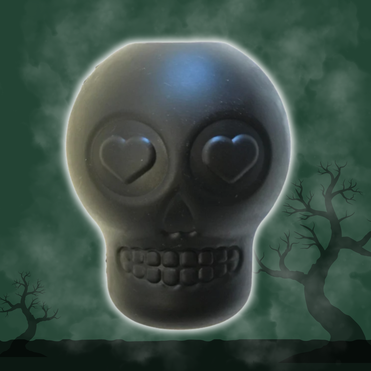 Black skull-shaped treat dispenser by Farm To Pet for dogs, featuring Halloween and Day of the Dead themed designs.