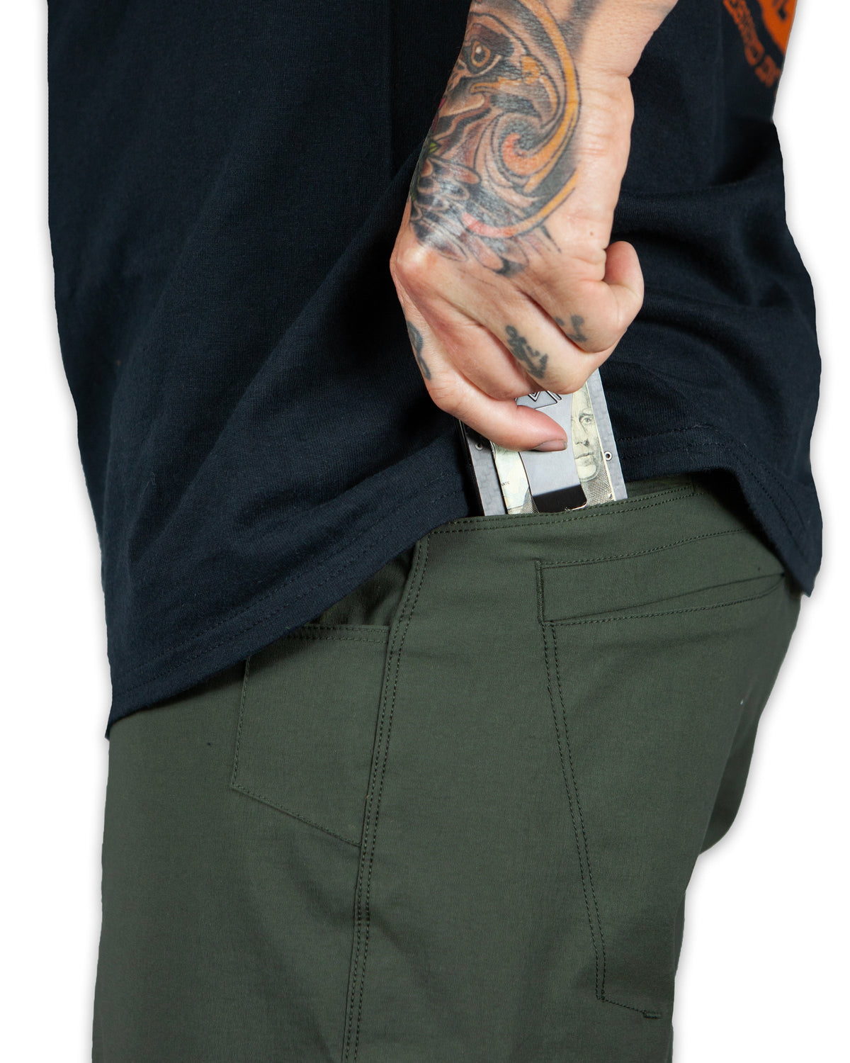 Dark army green Off The Grid Surplus field shorts with multiple pockets and durable fabric, designed for outdoor wear.