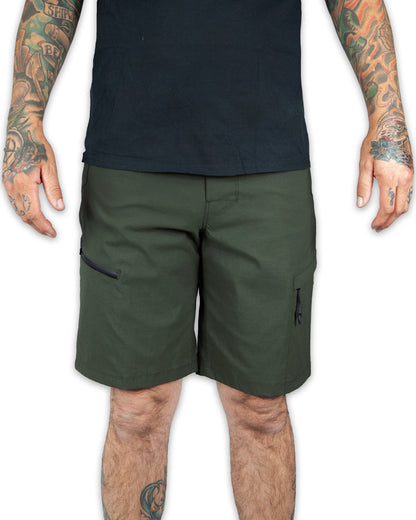 Dark army green field shorts by Off The Grid Surplus featuring multiple cargo pockets and durable fabric.