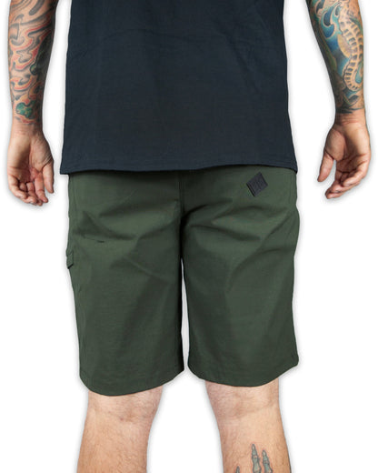 Dark army green Off The Grid Surplus field shorts with multiple pockets and rugged fabric, suitable for outdoor activities.