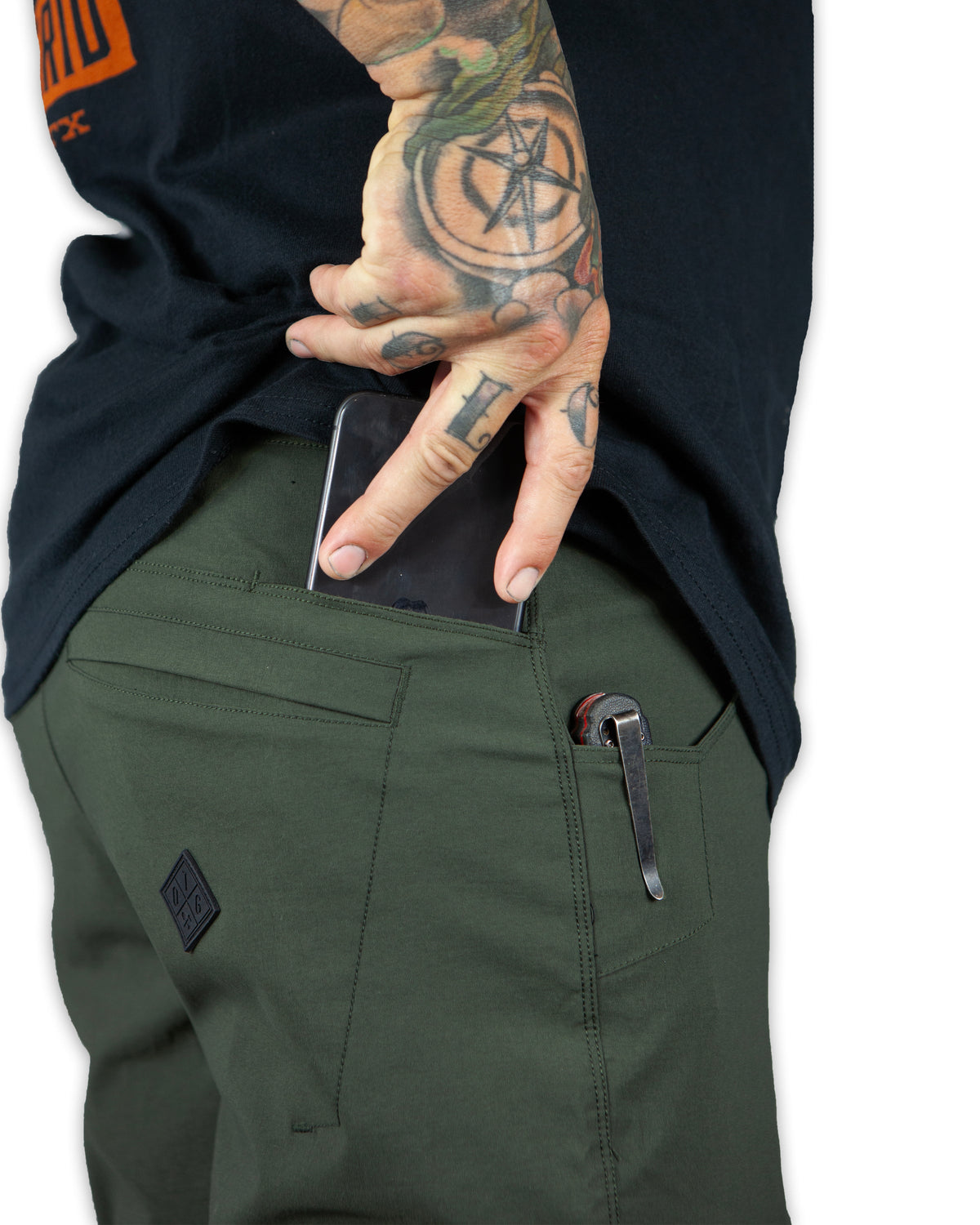 Dark army green field shorts by Off The Grid Surplus, featuring durable fabric and practical design for outdoor wear.