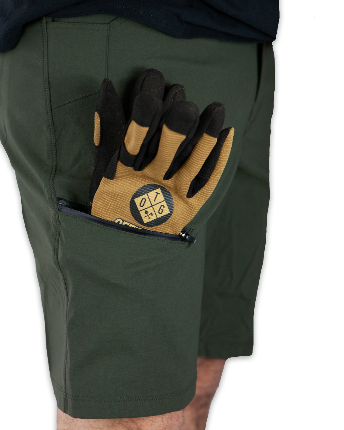 Dark army green field shorts by Off The Grid Surplus with cargo pockets and adjustable waistband.