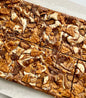 Let's Get Baked Artisan Desserts FlufferNutter Brownie, a rich chocolate cake with peanut butter filling and creamy frosting.