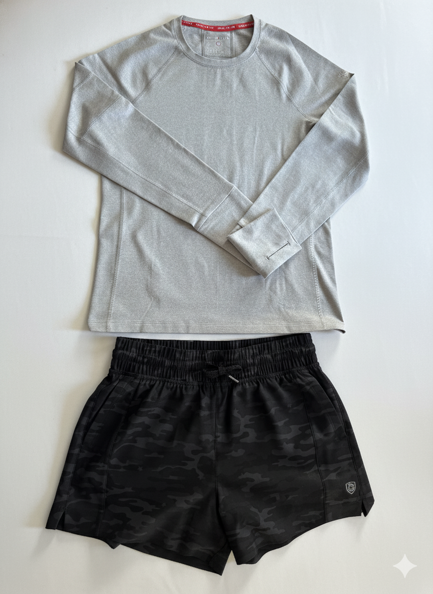 Goal Five Foudy 2.0 women's long sleeve athletic training top in ash heather with black camo shorts.