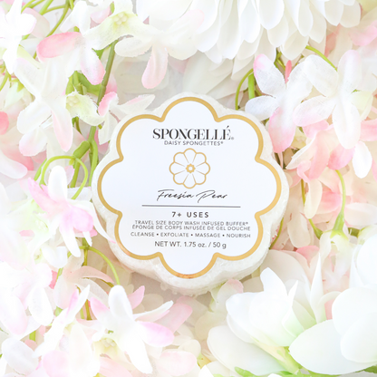 Freesia Pear Daisy Spongette body wash-infused buffer by Spongellé with a floral design and soft sponge texture for gentle cleansing.