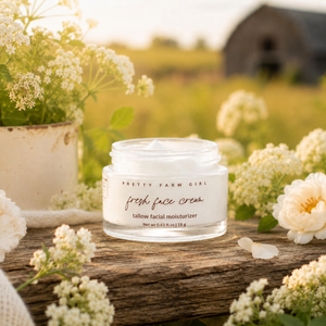 Fresh face cream by Pretty Farm Girl, an anti-aging tallow moisturizer in a jar, with smooth, creamy texture and natural ingredients.
