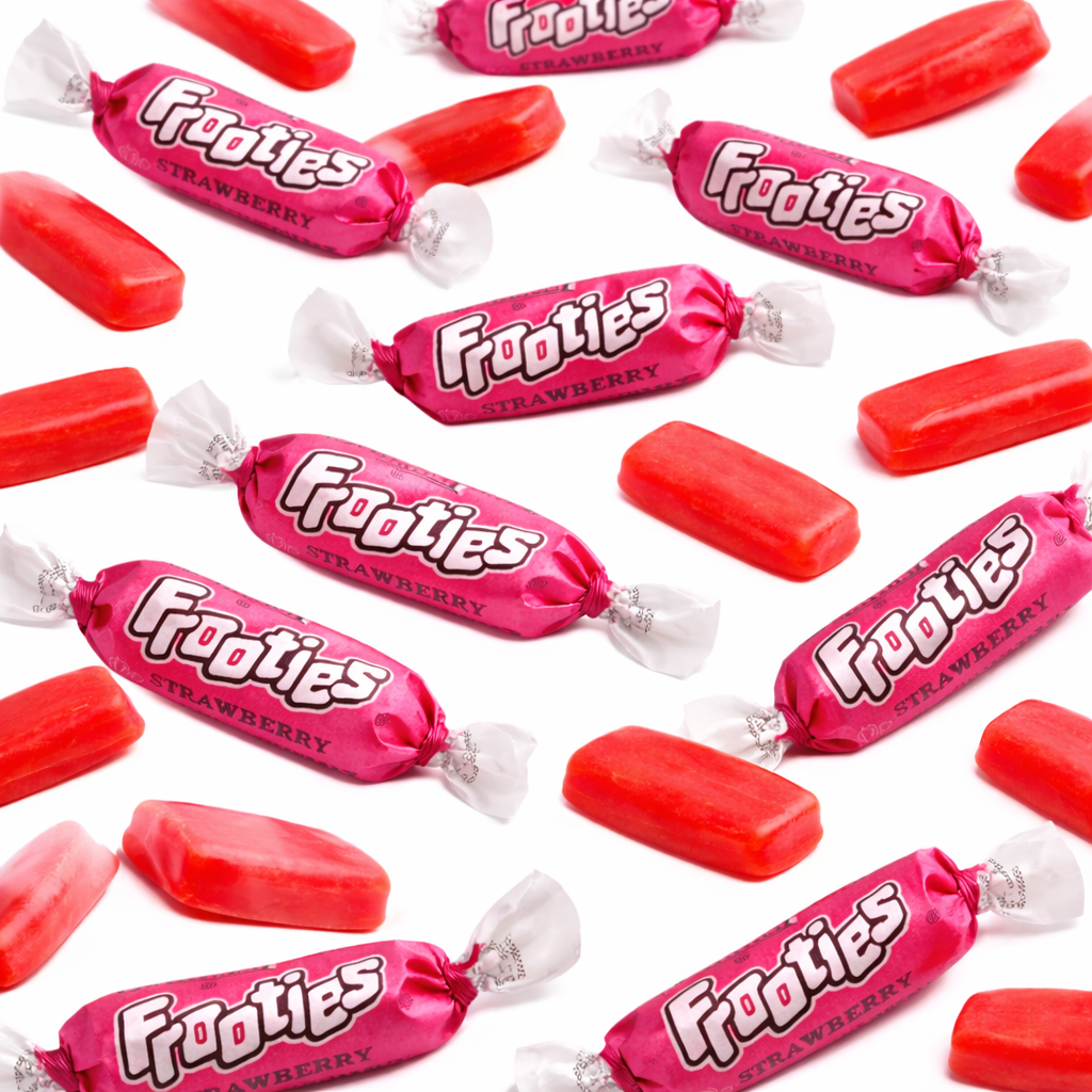 Chewy strawberry Tootsie Frooties candy in bulk bag, showing vibrant red candies from Candy In Bulk.