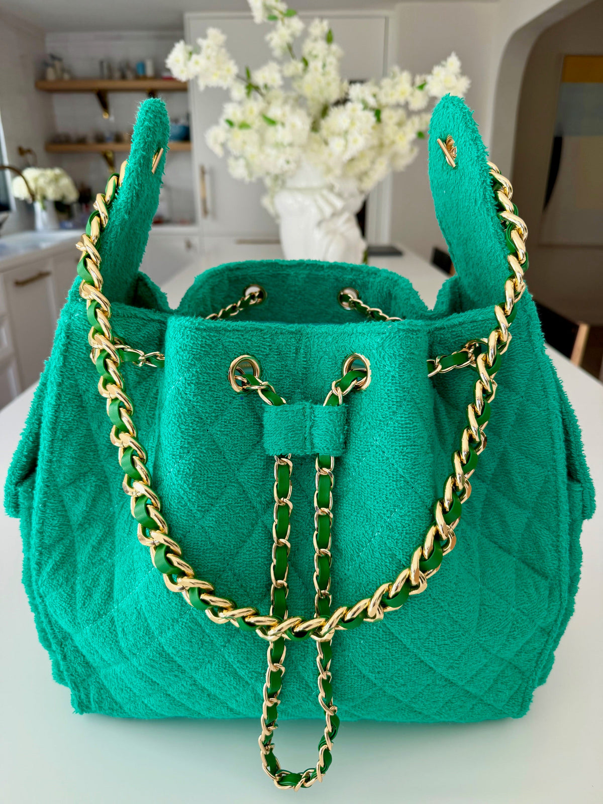 Medium Kelly Green Bayshore Bucket by BEACH HAUS, showing its round shape and vibrant color, perfect for beach outings.