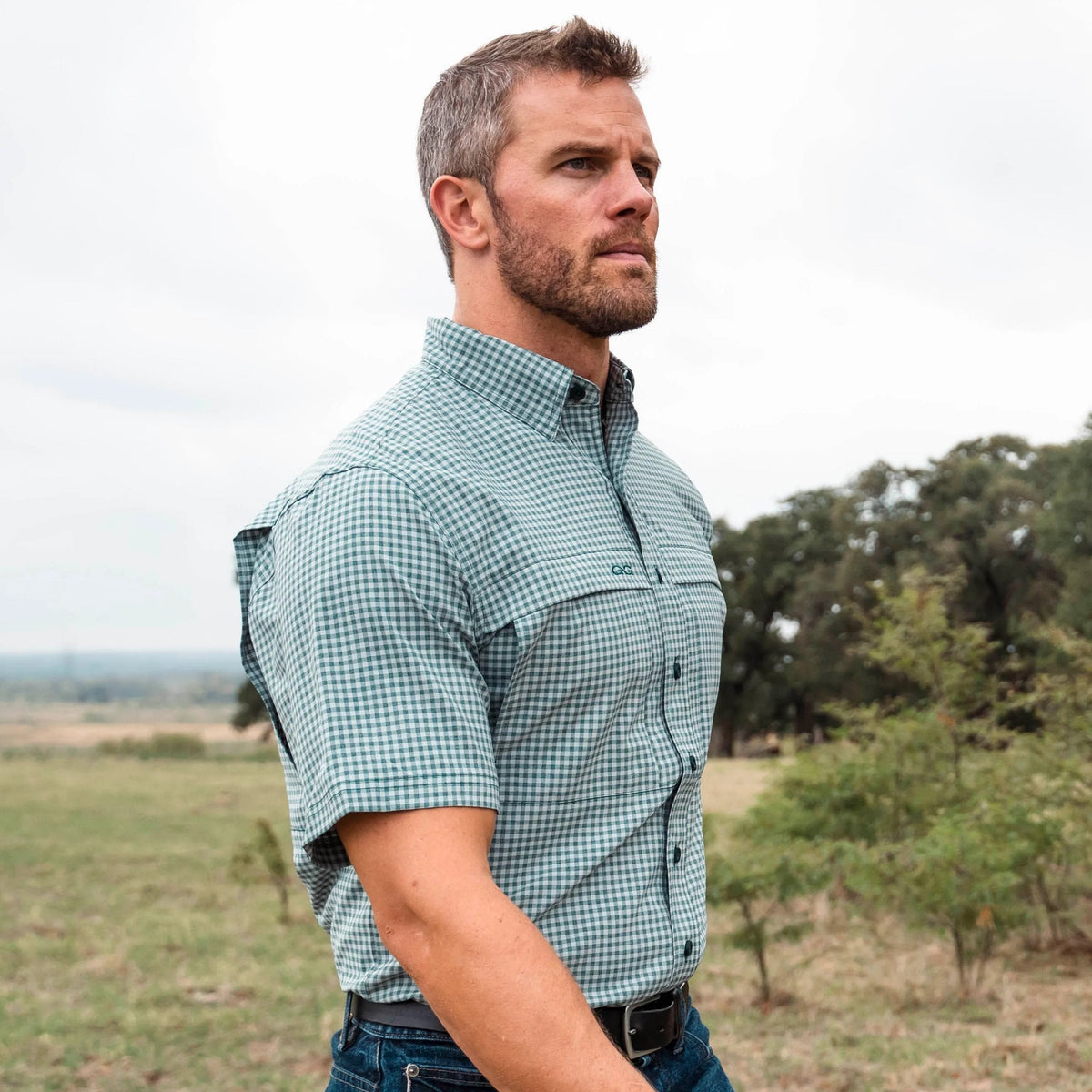 GameGuard Mallard TekCheck shirt featuring a plaid pattern, button-up style, and casual fit, displayed on a hanger.