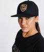 Goal Five G5 Flat Billed Snap Back Hat, lifestyle image showing black cap with adjustable snap closure and flat brim.