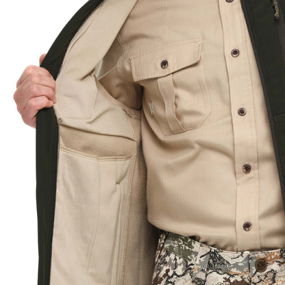 GameGuard Juniper Guía Grande™ vest, lightweight outdoor vest with multiple pockets, shown on a person wearing it outdoors.
