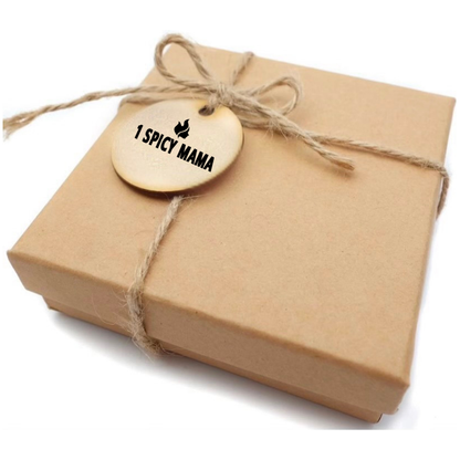 Seasonal gift package B from 1 Spicy Mama with assorted sauce bottles in a decorative gift box.