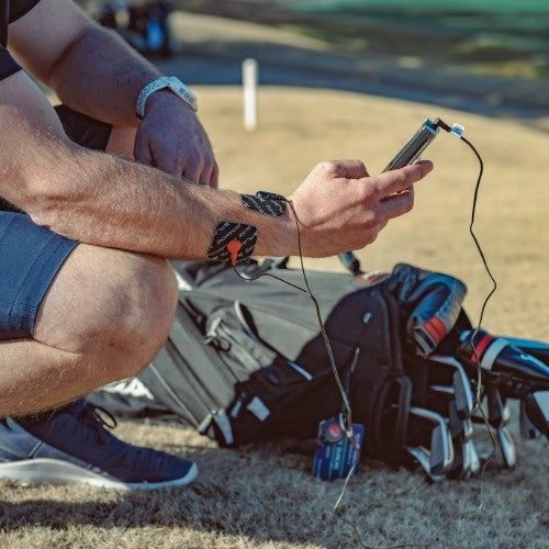 iReliev SPORT TENS + EMS muscle stimulator TENS unit with adjustable settings and handheld design for pain relief and muscle recovery.
