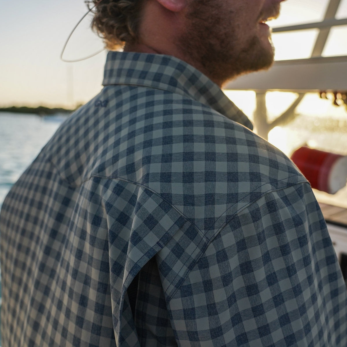 Men's Mesquite Pearl Snap Shirt by GameGuard, showing the stylish pearl snap buttons and patterned fabric detail.