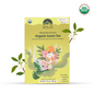 Organic Ganesha Green Tea by Nepal Tea featuring a vibrant green tea leaf blend in a clear tea cup.