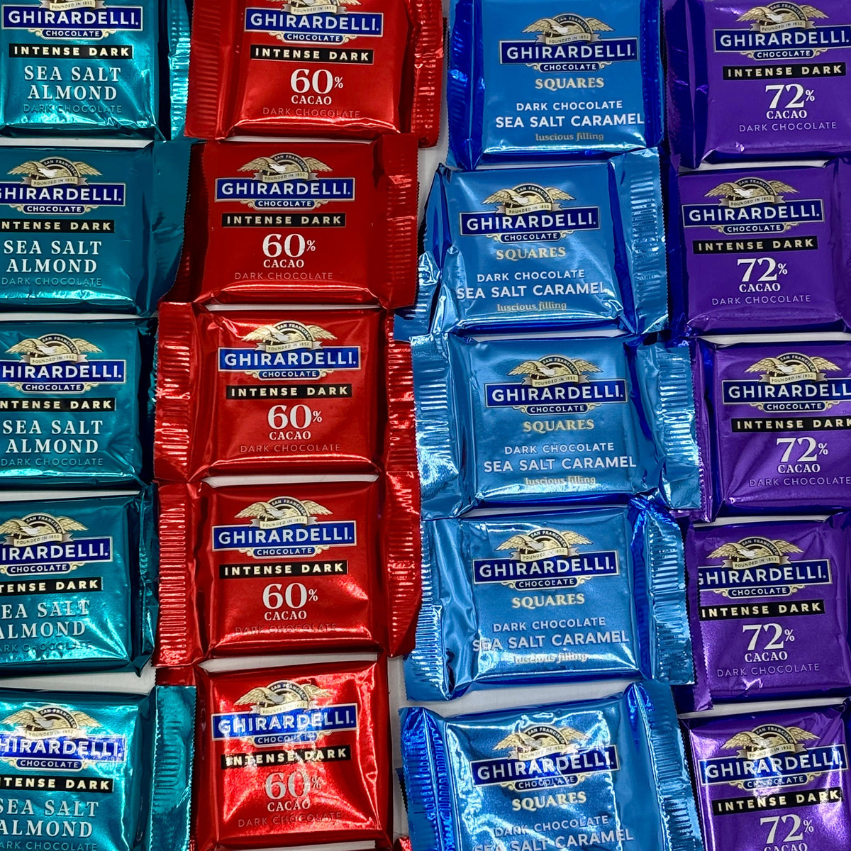 Assorted Ghirardelli dark chocolate squares in a bulk value bag, showcasing a variety of rich, smooth chocolate pieces from Candy In Bulk.