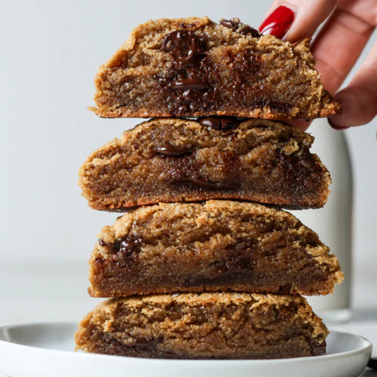 Gluten-free vegan chocolate chip cookie from Sweet Addison's with visible chocolate chips and a golden-brown baked appearance.