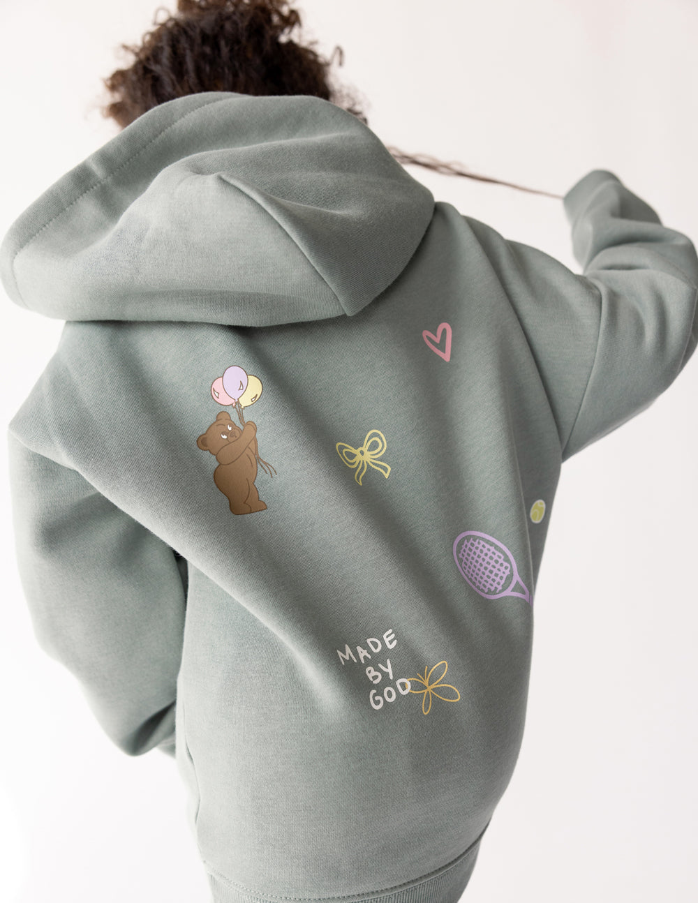 Kids hoodie by Elevated Faith featuring "God Made Me" design, soft fabric, and comfortable fit for children.