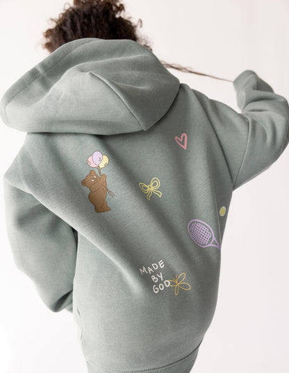 Kids hoodie by Elevated Faith featuring "God Made Me" design, soft fabric, and comfortable fit for children.