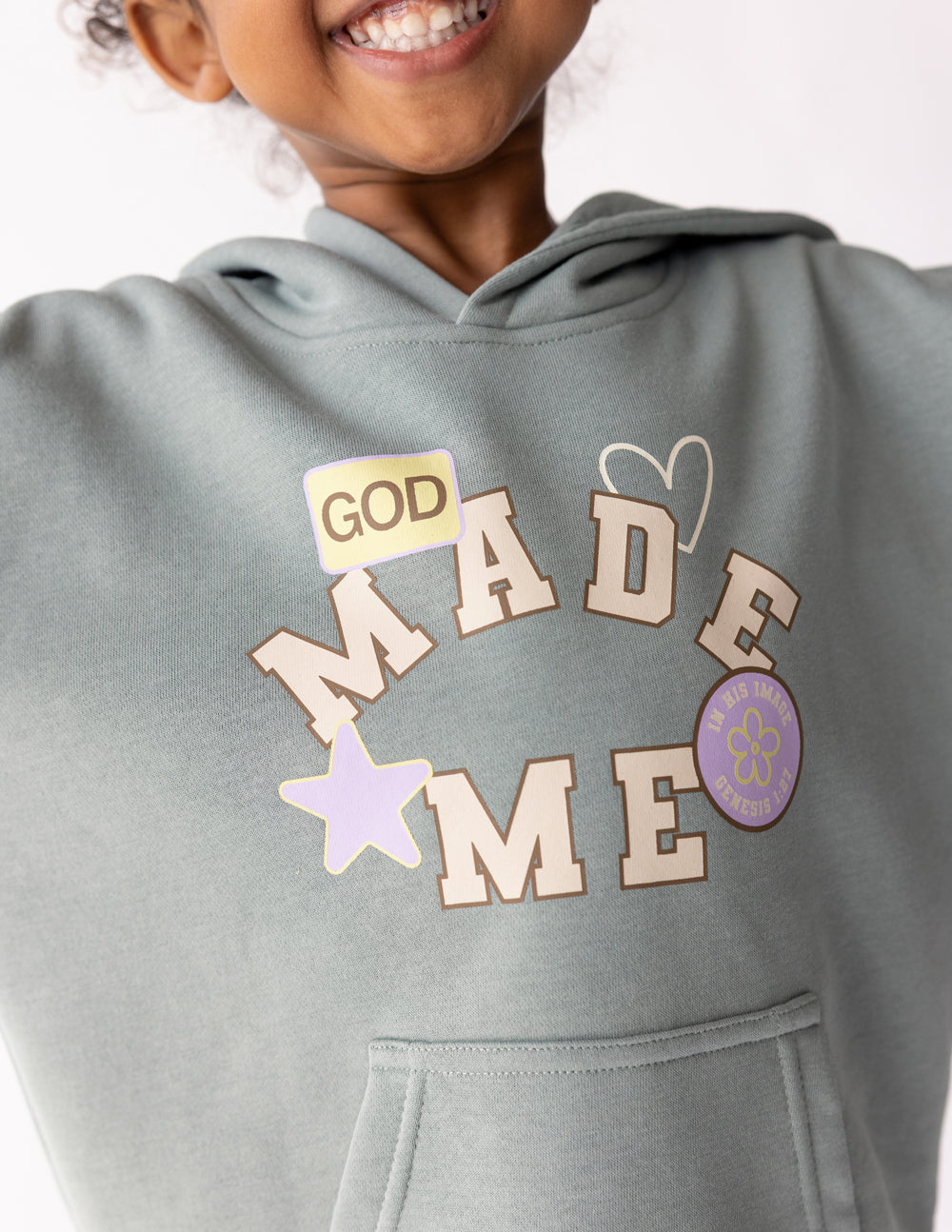 Kids hoodie by Elevated Faith featuring a "God Made Me" design, soft fabric and comfortable fit for children.