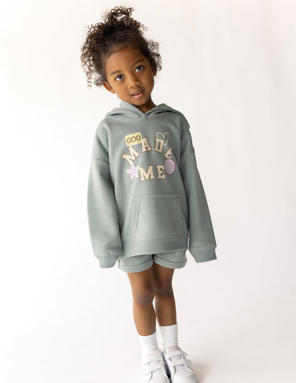Kids hoodie featuring "God Made Me" design from Elevated Faith, soft fabric, and comfortable fit for children.