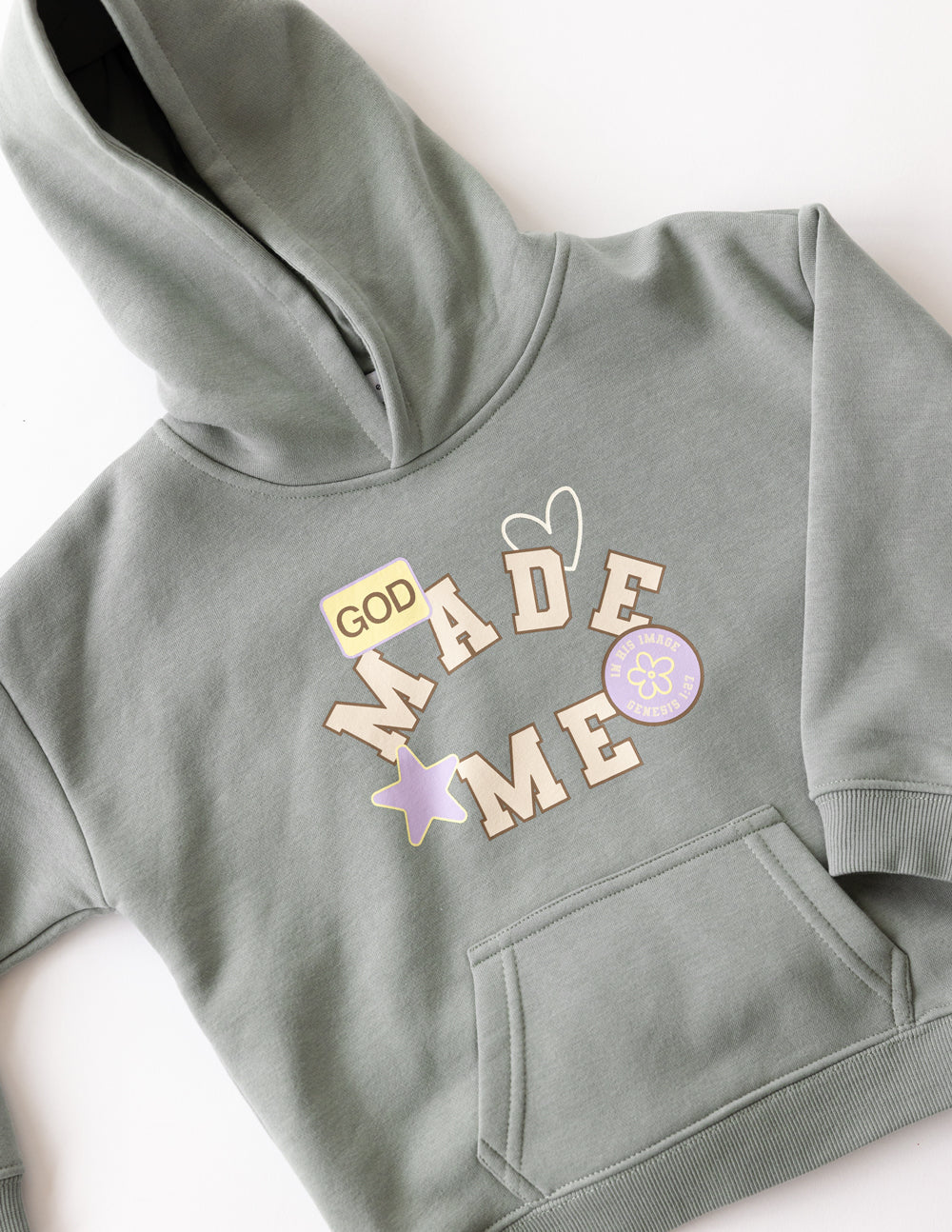 Kids hoodie by Elevated Faith featuring "God Made Me" design, soft fabric, and comfortable fit for children.