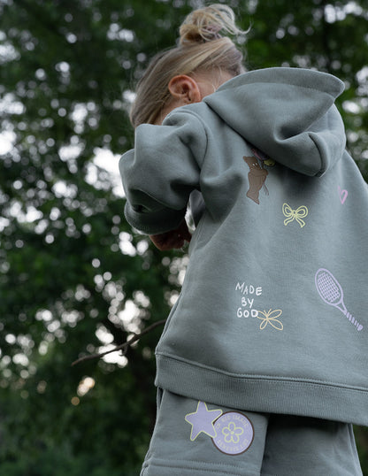 Brightly colored kids hoodie featuring "God Made Me" design by Elevated Faith, perfect for children’s casual wear.