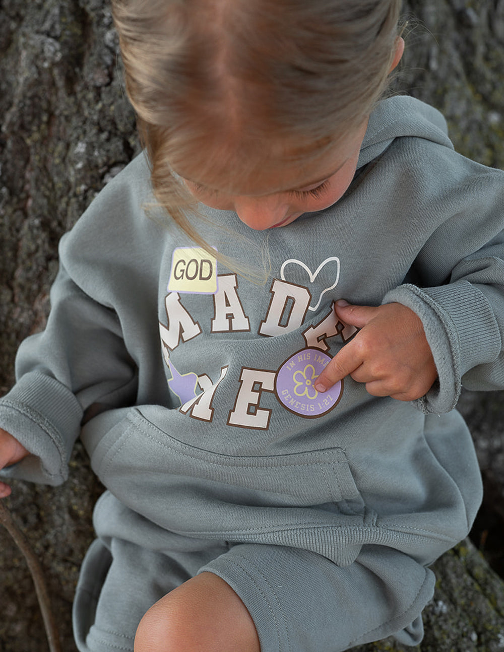 Kids hoodie by Elevated Faith featuring a "God Made Me" design, soft fabric, and comfortable fit for children.
