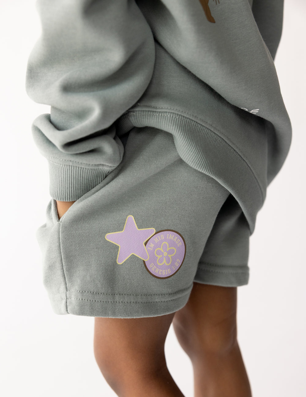 Kids' shorts by Elevated Faith featuring "God Made Me" design, made for comfortable kids' casual wear.